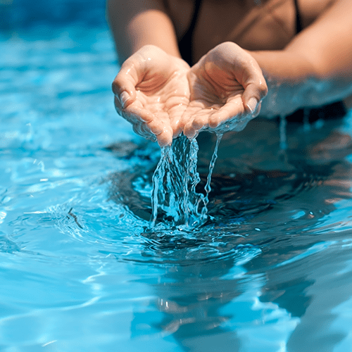 Image of girl playing with pool water