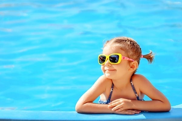 little-girl-smiling by pool